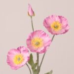 Pink faux poppy stem with soft silk petals, yellow center, and natural texture, ideal for wedding decor and event floral arrangements.