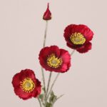 Red faux poppy stem with layered silk petals and textured center, ideal for wedding decor and event floral arrangements.