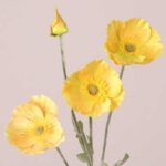Yellow faux poppy stem with bright silk petals and detailed center for wedding decor and event floral styling.