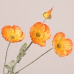 Orange faux poppy stem with soft silk petals and detailed center, suitable for wedding decor, event floral arrangements, and hotel styling.