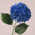 Blue faux hydrangea stem with rich layered petals and lifelike foliage, suitable for wedding decor and event floral arrangements