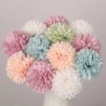 Assorted pastel faux hydrangea flowers arranged in a vase for wedding and event decor