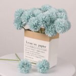 Light blue artificial dahlia bundle in paper bag for home decor