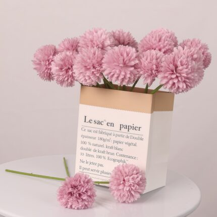 Pink artificial pom pom chrysanthemum bouquet in paper bag for floral centerpiece
