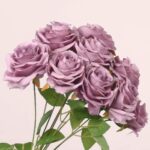 Mauve purple faux rose bouquet with soft layered petals and greenery suitable for elegant wedding and event floral setups