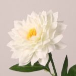 White faux dahlia flower with soft layered petals and natural yellow center for wedding and event decor