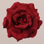 Red faux rose flower head with rich layered petals and realistic fabric texture, perfect for wedding decor and event floral arrangement