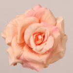 Peach faux rose flower head with layered petals and natural fabric texture, suitable for wedding decor and event floral arrangement