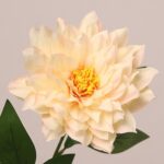 Cream faux dahlia flower with soft layered petals and natural center for wedding and event decor use