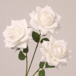 White faux rose spray with three realistic blooms and subtle petal texture for wedding and event floral design