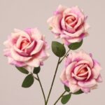 Lavender pink faux rose spray with gradient petals and lifelike texture for wedding and event arrangements