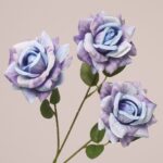 Blue purple faux rose spray with layered petals and artistic color tones for event and wedding decor