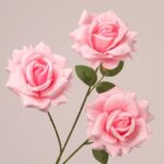 Light pink faux rose spray with delicate petals and realistic structure for wedding floral arrangements