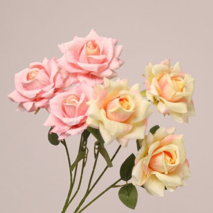 Mixed pink and yellow faux rose bouquet with multiple blooms for wedding and event floral decoration