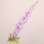 Lavender faux delphinium stem with soft layered petals and lifelike leaves for wedding decor and event floral arrangements