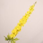 Bright yellow faux delphinium stem with full layered petals and lifelike greenery for wedding decor and event floral arrangements