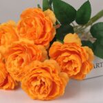 Bright orange artificial garden roses bouquet for wedding floral arrangement