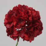 Burgundy faux hydrangea stem with deep layered petals for wedding decor and sophisticated event floral arrangement styling