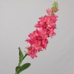 Hot pink faux freesia stem with layered blossoms for wedding decor and vibrant event floral arrangement styling