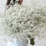White faux baby's breath spray with clustered tiny blooms for wedding decor and soft event floral arrangement styling