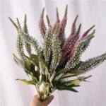 Close-up of realistic faux salvia wildflower stems in lavender.