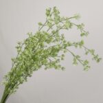 Close-up of a tall artificial white filler flower branch with delicate clustered petals and green stems by NB8.