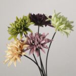 A bouquet of multi-colored artificial dahlia flower stems including green, purple, lime, cream, and dusty pink.