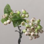 High-quality artificial berry spray featuring green and cream bicolor berries with realistic brown tips and lush green leaves against a gray background.