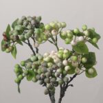 A full bundle of mixed artificial berry sprays combining green-and-white bicolor berries and solid dark green berries with fresh green leaves.
