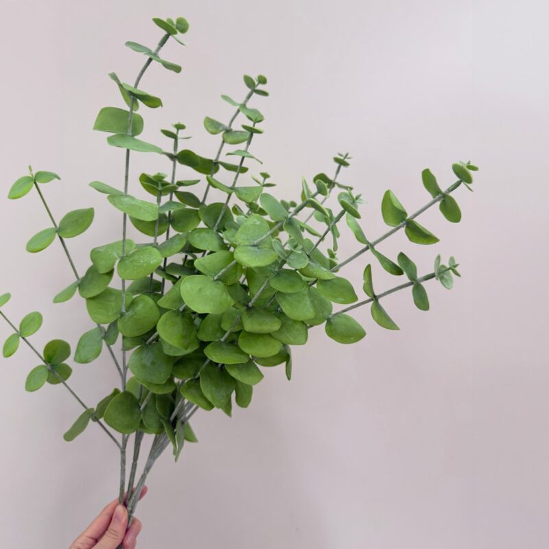 A dense bundle of artificial green eucalyptus stems showing realistic volume for home vase arrangements.