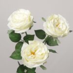 Close-up view of three premium faux cream-white blooming roses showing intricate layered petals and lifelike green rose leaves.
