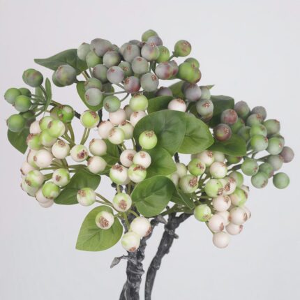A full bundle of mixed artificial berry sprays combining green-and-white bicolor berries and solid dark green berries with fresh green leaves.