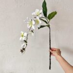 Realistic 3D silk jasmine garland with deep green leaves for elegant home or wedding decor.