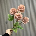 Silk artificial hydrangea arrangement featuring four blush pink flower heads on green stems.