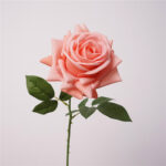 Realistic pink faux rose bloom perfect for artificial wedding flowers or home decor.