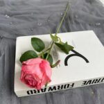 Beautiful pink faux silk rose displayed on an elegant 'Drive Forward' themed gift box.