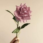 Realistic silk faux rose stem, ideal for artificial wedding flowers or elegant home decor accents.