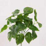 Artificial plastic leaves for home decor and crafts; vibrant faux greenery foliage