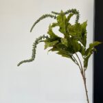 Fresh perilla leaves with delicate trailing blossoms for natural floral arrangements.