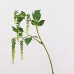 Hanging artificial filler flowers with vibrant green leaves, perfect for crafts and home decoration.