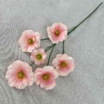 6 heads of soft pink silk butterfly artificial flowers arranged on a light gray background.