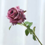 Realistic faux rose bloom on a stem, perfect for wedding centerpieces or home decor.