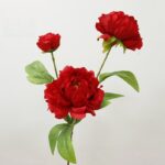 Set of three artificial red silk peonies with vibrant green foliage