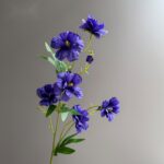 Artificial deep purple silk butterfly peony flowers bouquet on green stems.