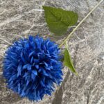 Blue silk artificial flower bunch with leaves for realistic wedding or home decor.