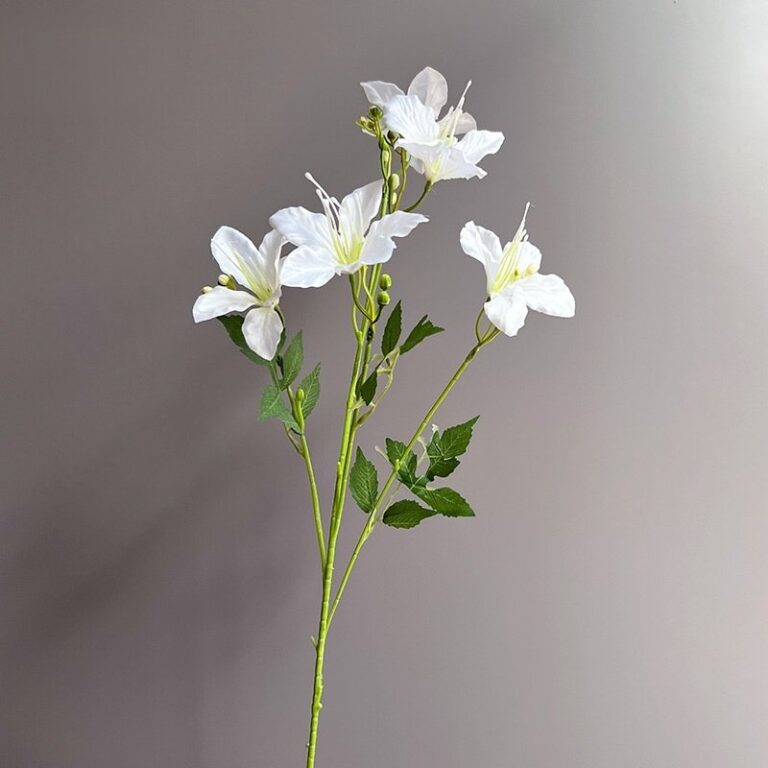 Bouquet of realistic silk white lilies perfect for artificial floral arrangements or home decor.