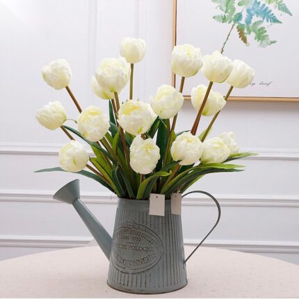 Artificial silk white tulips bouquet arranged in a distressed enamel farmhouse vase.