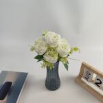 Bouquet of 7 white silk roses in a gray vase centerpiece arrangement
