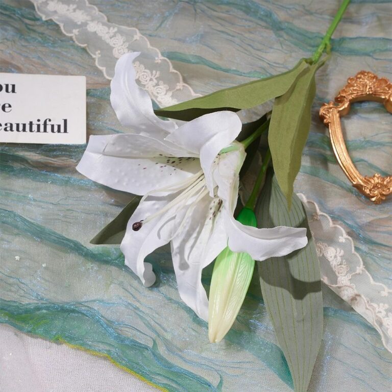 White silk lily artificial flower bouquet with green foliage perfect for home decoration.