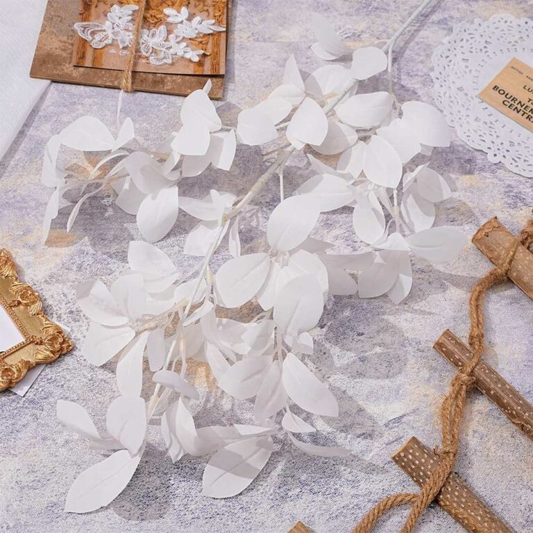 Bundle of artificial white silk leaves for wedding decor or floral arrangement.